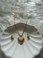 Discover the allure of the Filigree Locket Heart Necklace stainless