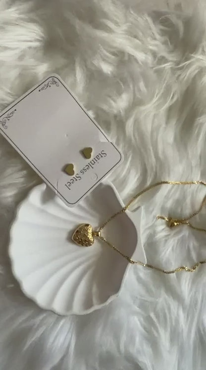 Discover the allure of the Filigree Locket Heart Necklace stainless